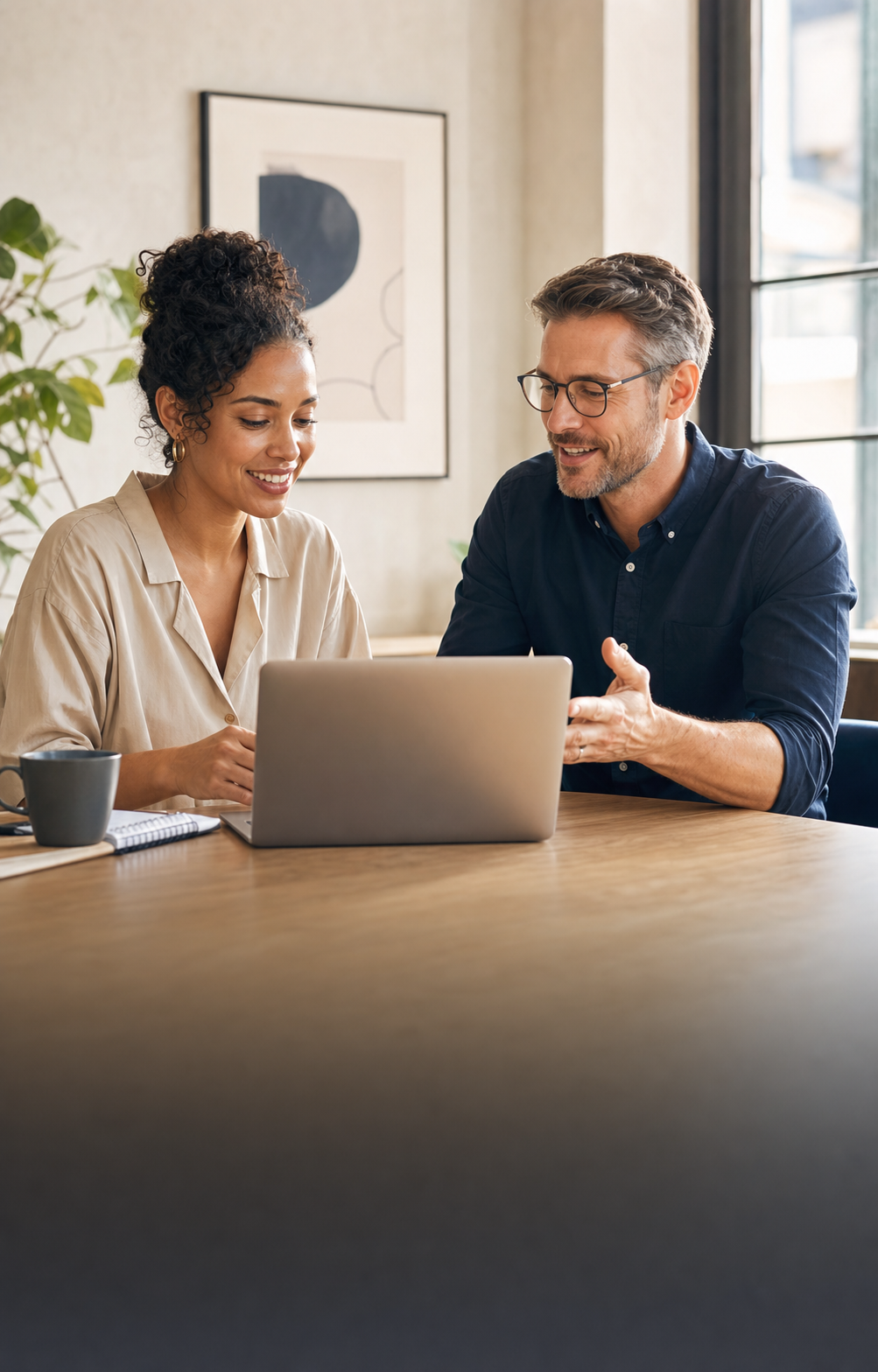 Two professionals collaborating on an AI strategy